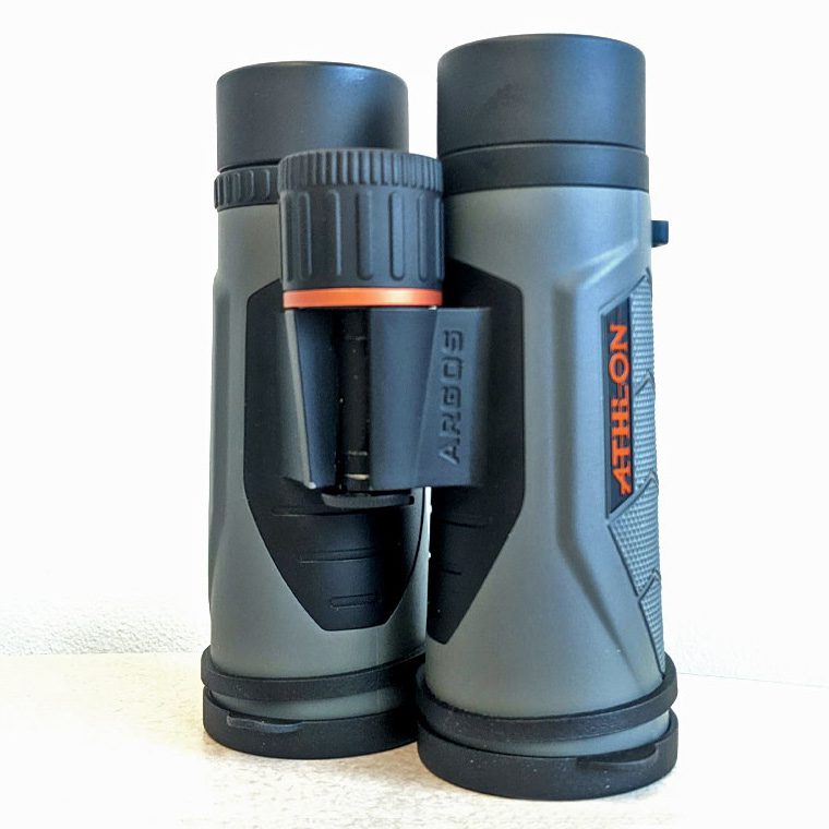 Dark and light gray binoculars with orange details.