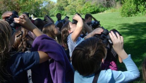 students take a brain break with binoculars